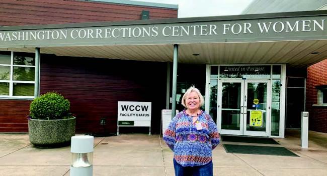  Sharon Kirkpatrick pauses outside the Washington Corrections Center for Women, where every month she and Sharon Bruner-Rowe lead a support group that is part of the Washington State Department of Veterans Affairs Women Veterans Advisory Committee’s outreach efforts. Together, the two facilitators are known as “The Sharons.” | Photo courtesy of Sharon Kirkpatrick